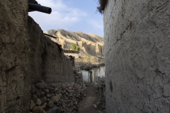 en route in the village Yara - they built their houses out of stones, loam and the roof mainly from bush woods..